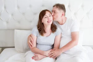 middle-age-family-couple-white-bedroom-bed-husband-kiss-wife-love-romance-healthy-relationship-middle-age-family-couple-128238644